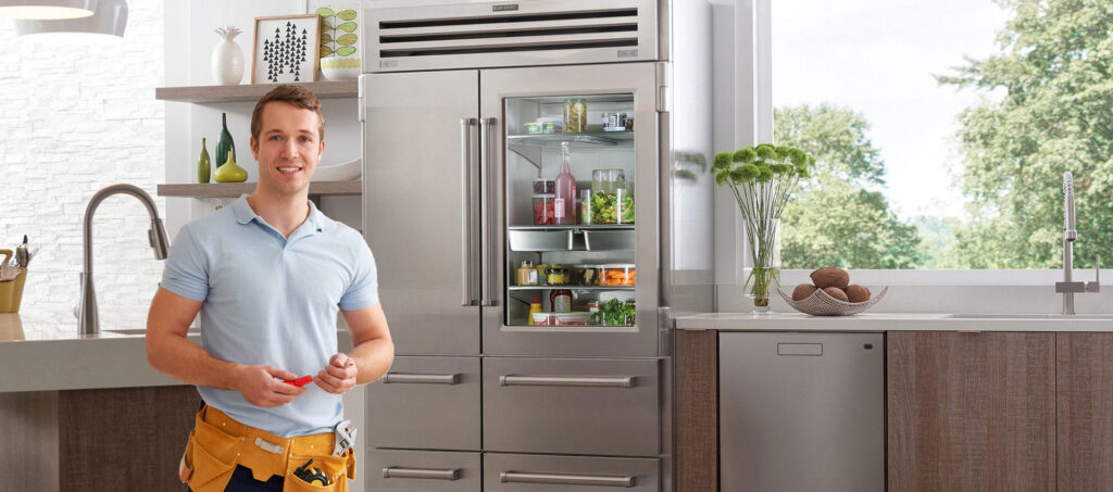 technician working on a Sub-Zero refrigerator